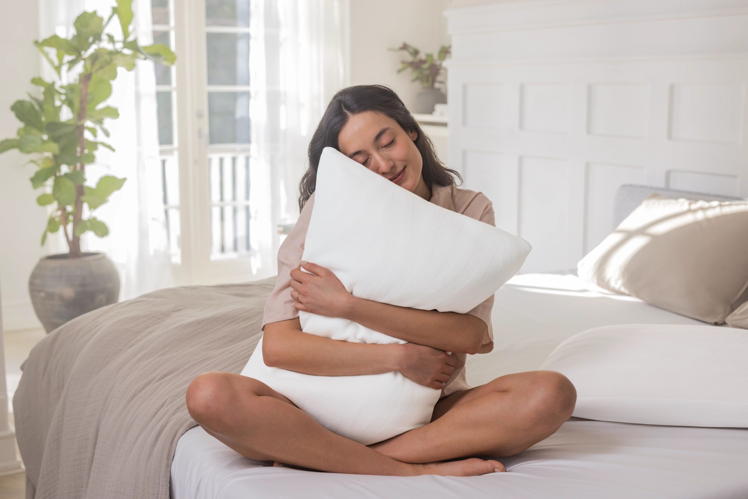 Woman hugging a pillow