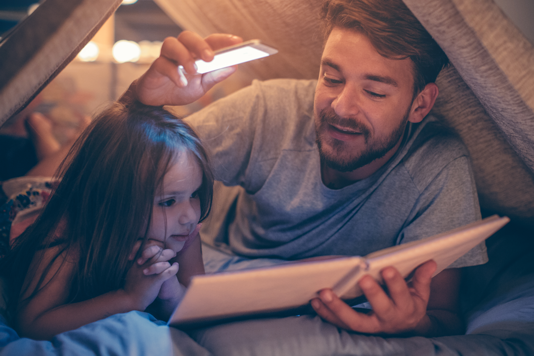 Father and daughter read books