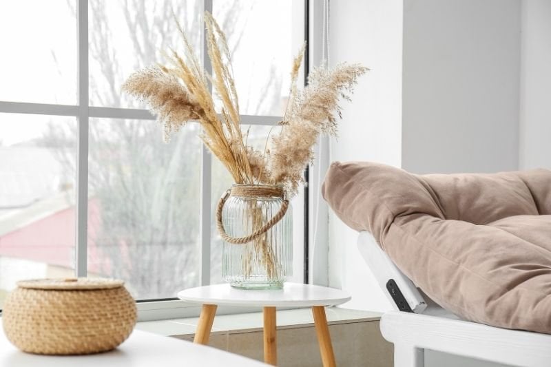 Artificial plant decoration in a vase on the coffee table